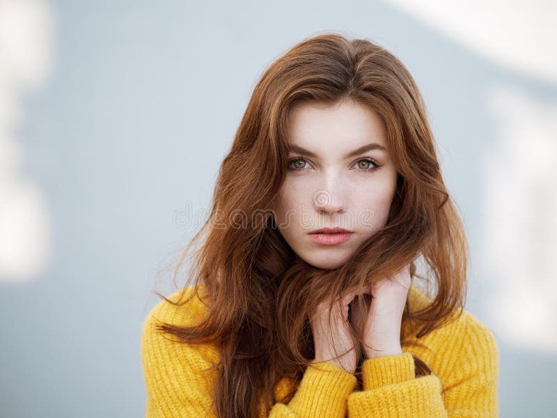 Pretty Redhead With Long Red Hair And Yellow Jacket